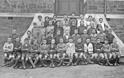 Burra Primary School children, Grade VI, 1920, taken on the front steps of the main building.